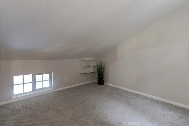 a bathroom with a sink a mirror and a shower