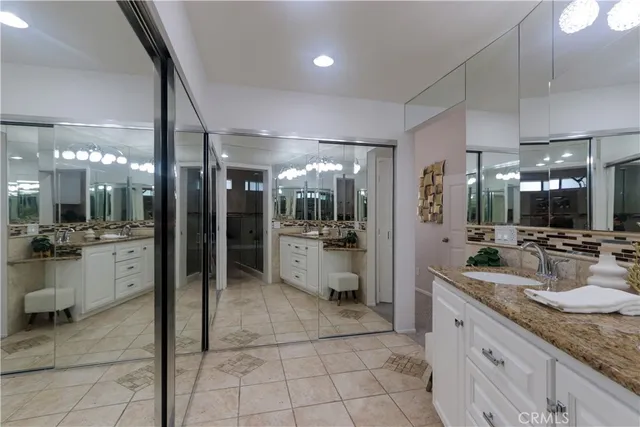 a kitchen with kitchen island granite countertop counter top space a sink and cabinets