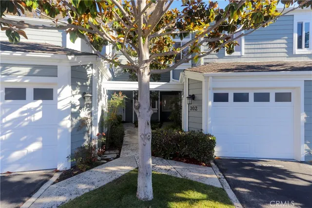 a front view of a house with yard