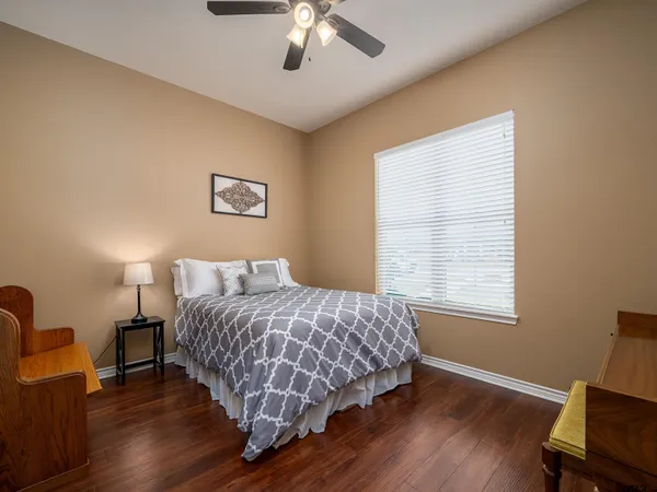 a bedroom with bed and window