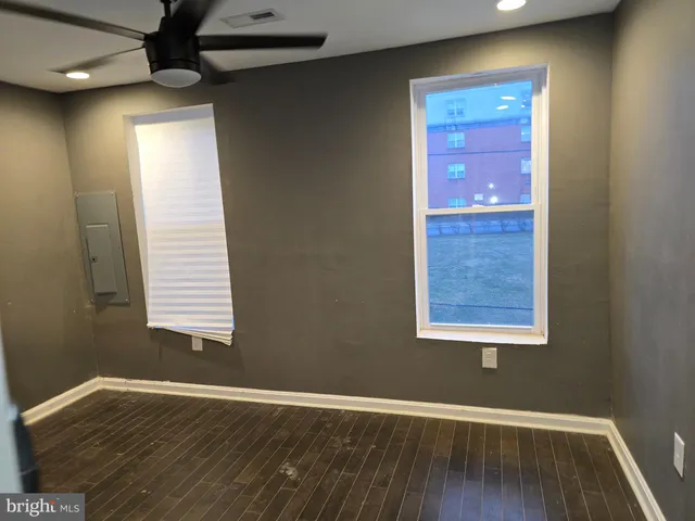 a view of a bathroom with wooden floor