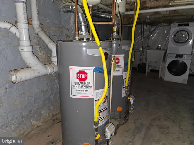 a view of a storage & utility room with washer and dryer