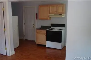 a kitchen with a stove and a microwave
