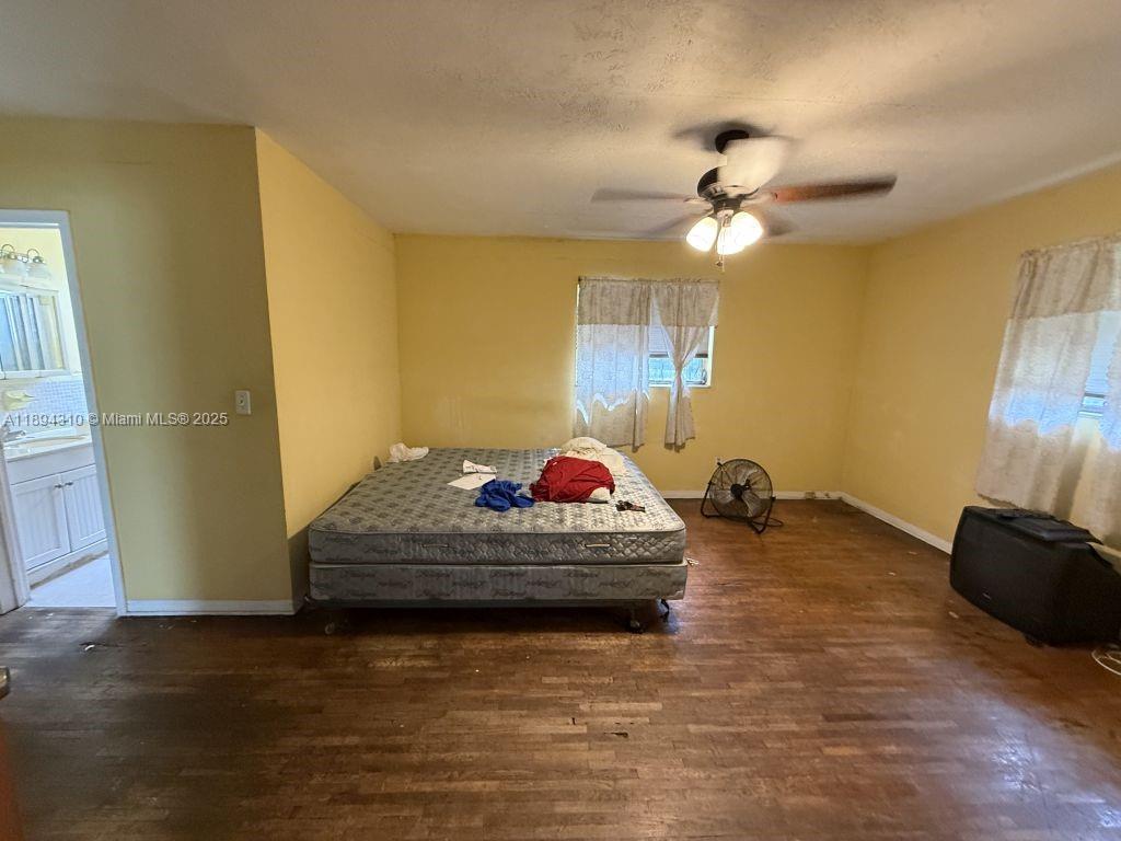 130 Northwest 48th Street Miami, FL 33127 - Photo 12 of 13 a living room with furniture and a chandelier