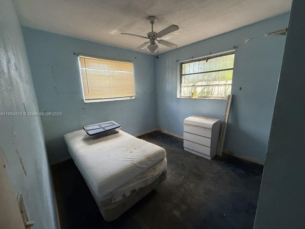 130 Northwest 48th Street Miami, FL 33127 - Photo 6 of 13 a bedroom with a bed and a window