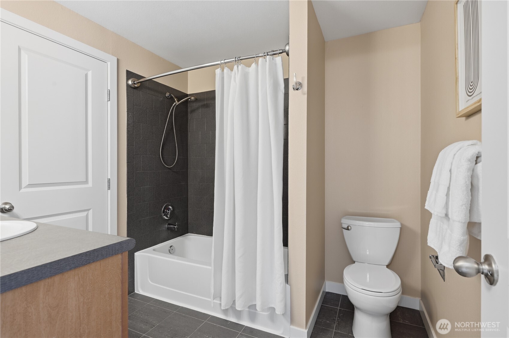 700 Front Street South, Unit E206 Issaquah, WA 98027 - Photo 14 of 32 a bathroom with a shower a toilet and a sink