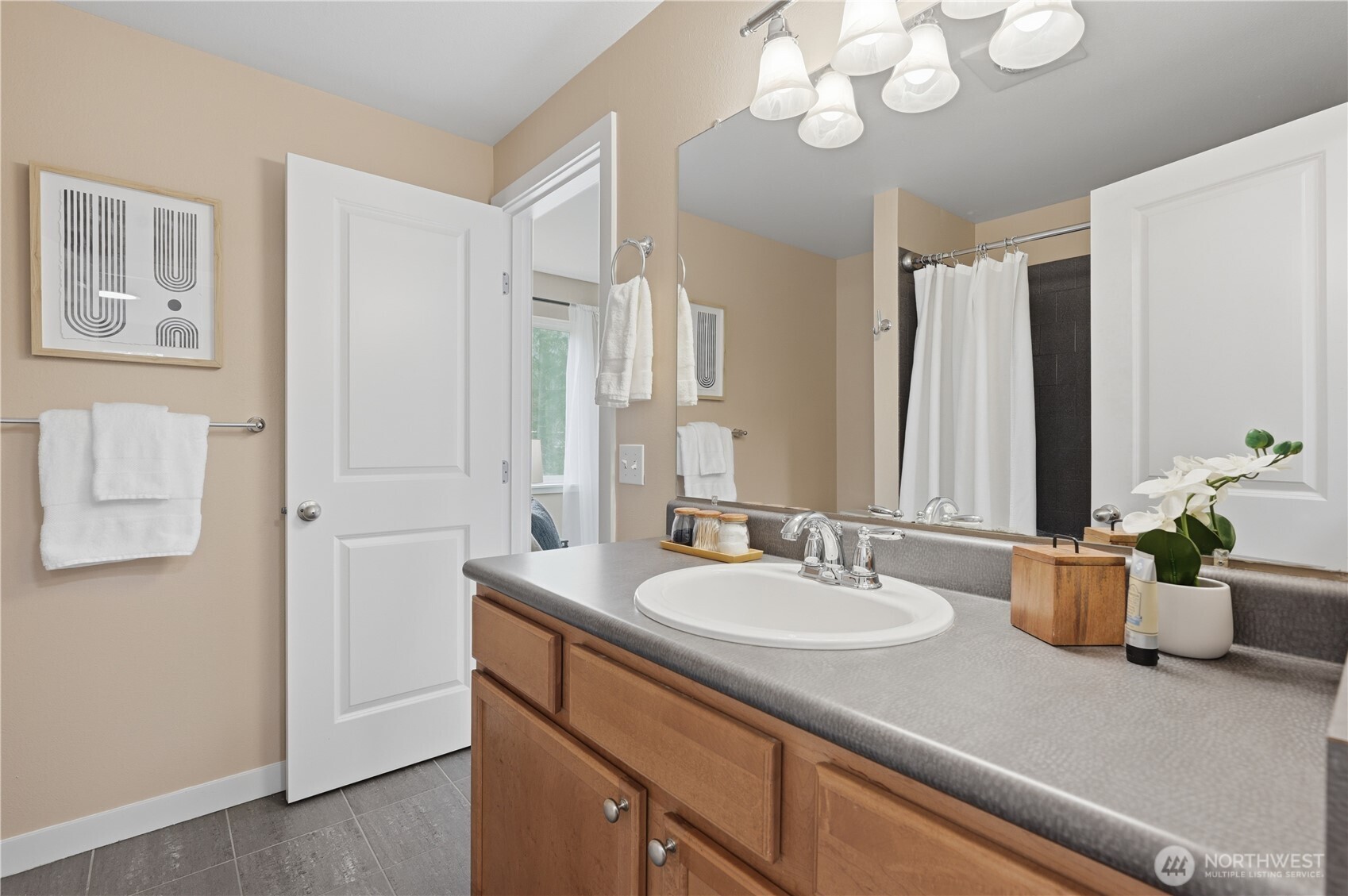 700 Front Street South, Unit E206 Issaquah, WA 98027 - Photo 15 of 32 a bathroom with a sink a large mirror and a window