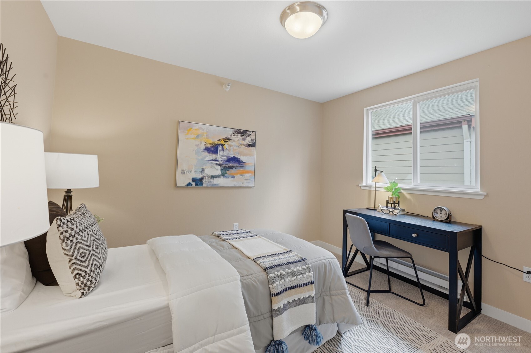 700 Front Street South, Unit E206 Issaquah, WA 98027 - Photo 16 of 32 a bedroom with a bed and a window
