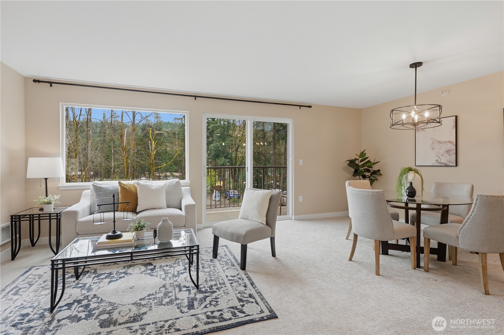 700 Front Street South, Unit E206 Issaquah, WA 98027 - Photo 8 of 32 a living room with furniture and a floor to ceiling window