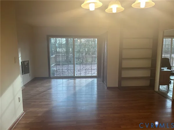a view of a livingroom with wooden floor