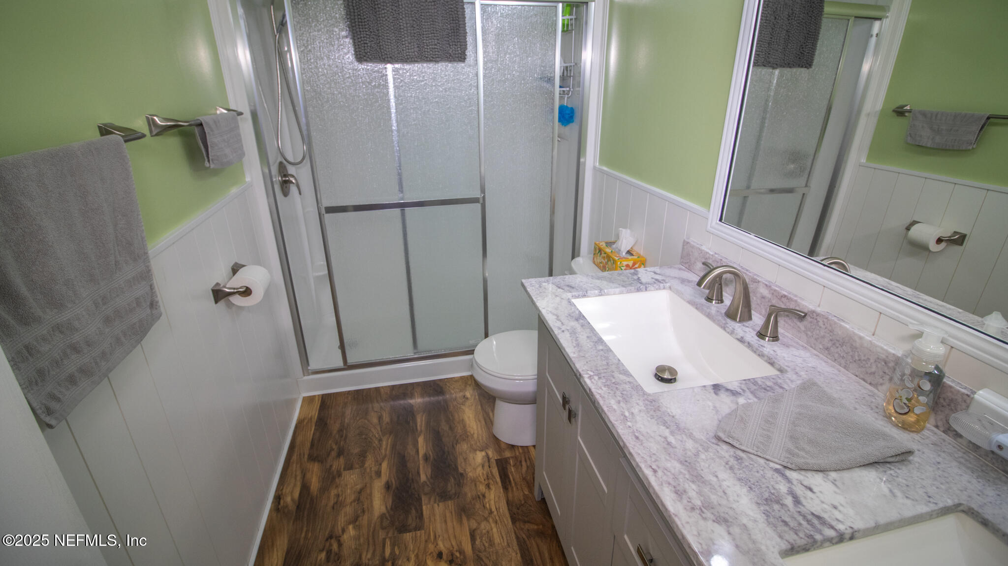 7110 Immokalee Road Keystone Heights, FL 32656 - Photo 15 of 36 a bathroom with a sink a toilet and shower