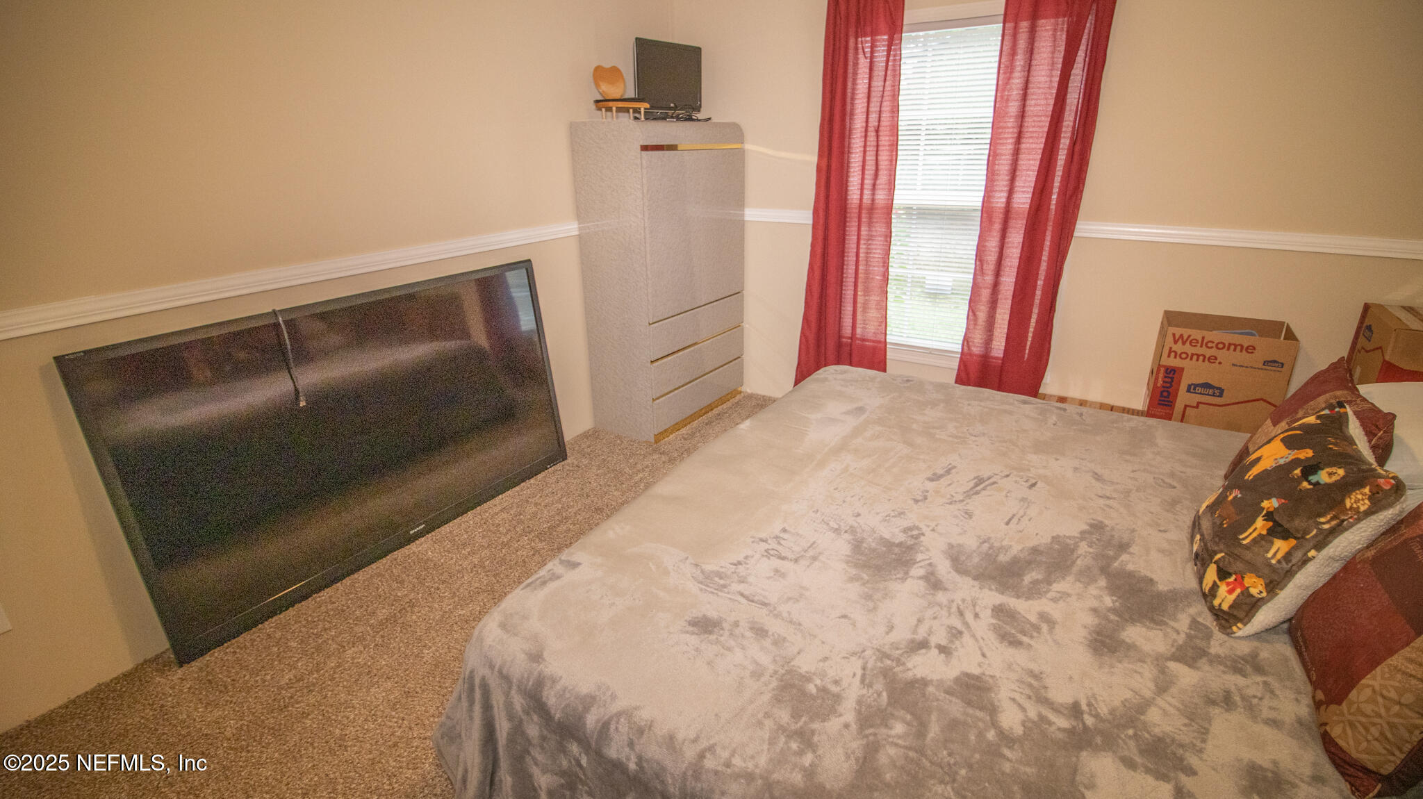 7110 Immokalee Road Keystone Heights, FL 32656 - Photo 20 of 36 a bedroom with a bed and a dresser