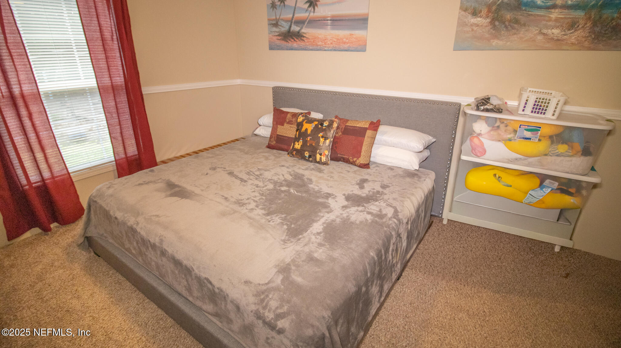 7110 Immokalee Road Keystone Heights, FL 32656 - Photo 21 of 36 a bed sitting in a bedroom next to a window