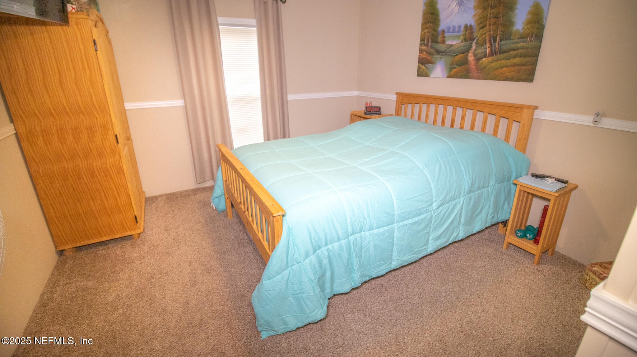 7110 Immokalee Road Keystone Heights, FL 32656 - Photo 22 of 36 a bedroom with a bed and a window