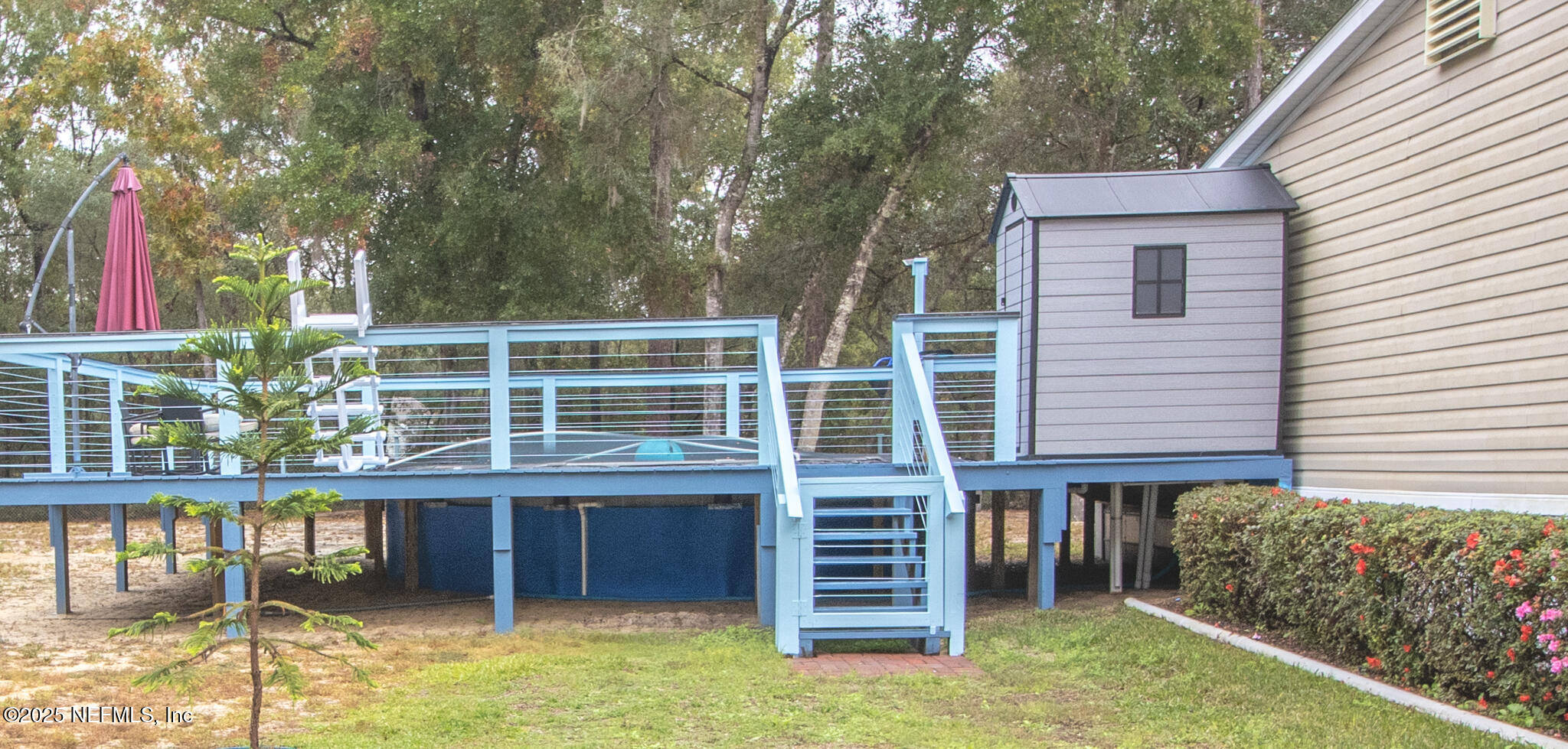 7110 Immokalee Road Keystone Heights, FL 32656 - Photo 29 of 36 a house view with a backyard space