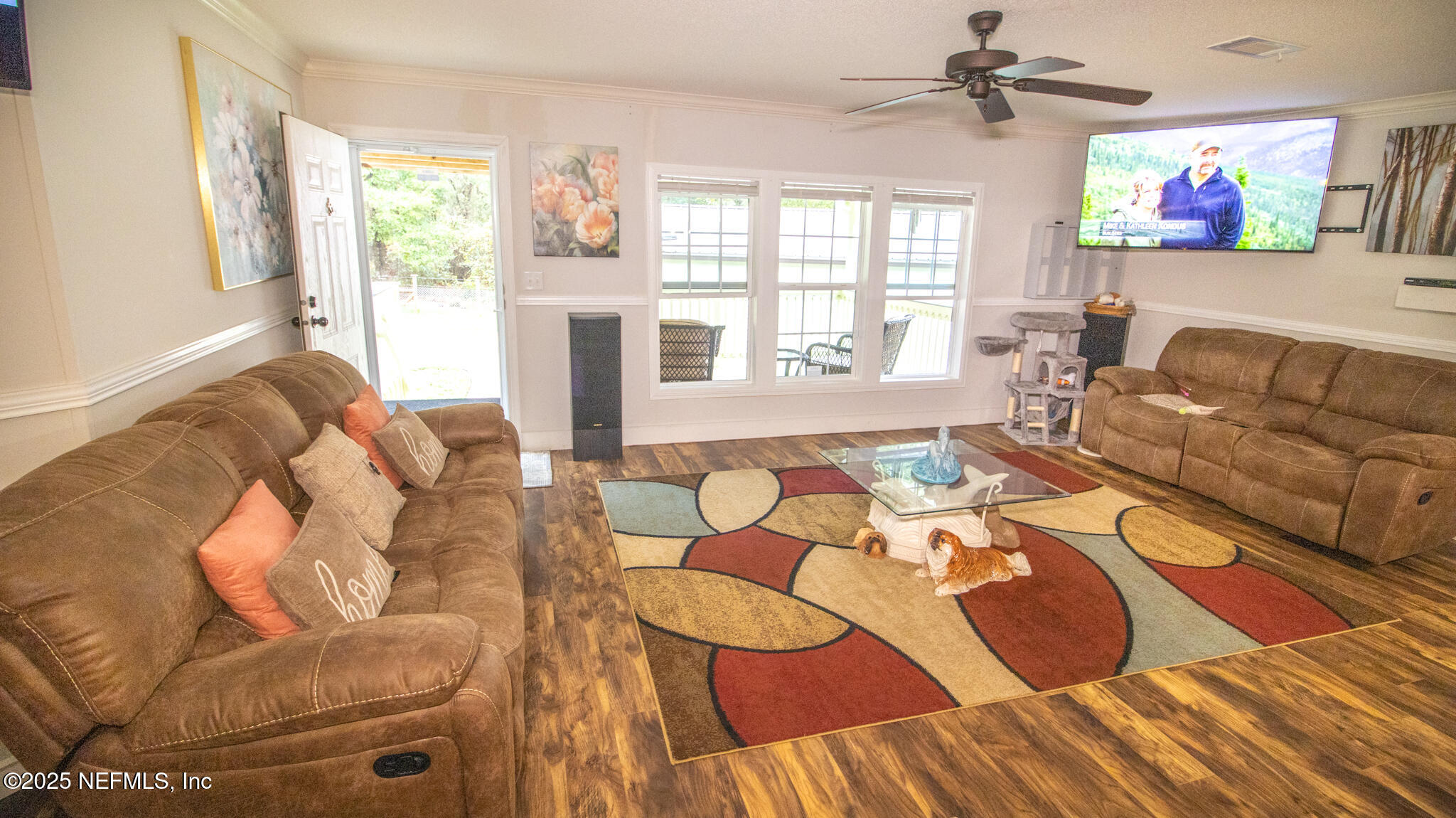 7110 Immokalee Road Keystone Heights, FL 32656 - Photo 4 of 36 a living room with furniture and a floor to ceiling window