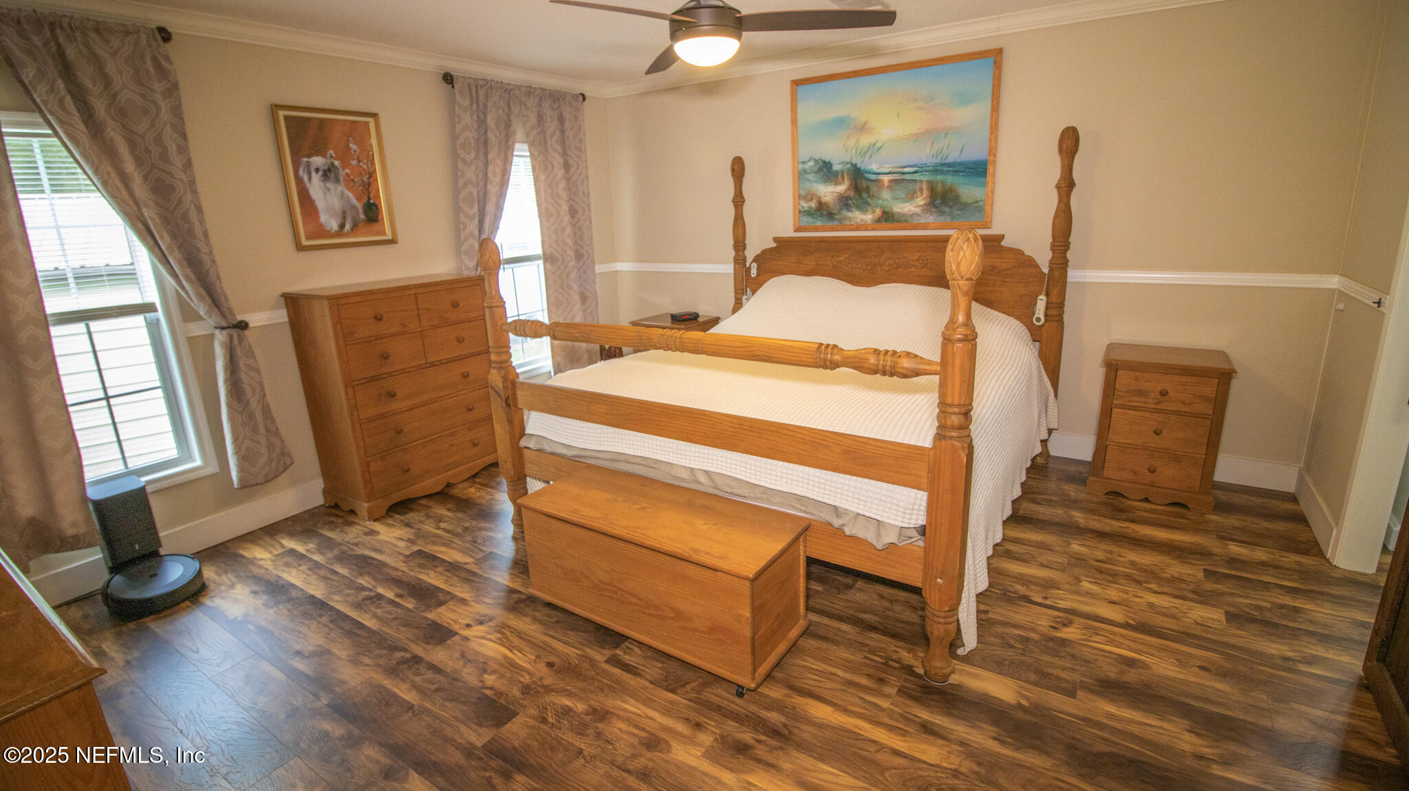 7110 Immokalee Road Keystone Heights, FL 32656 - Photo 10 of 36 a bedroom with a bed and wooden floor