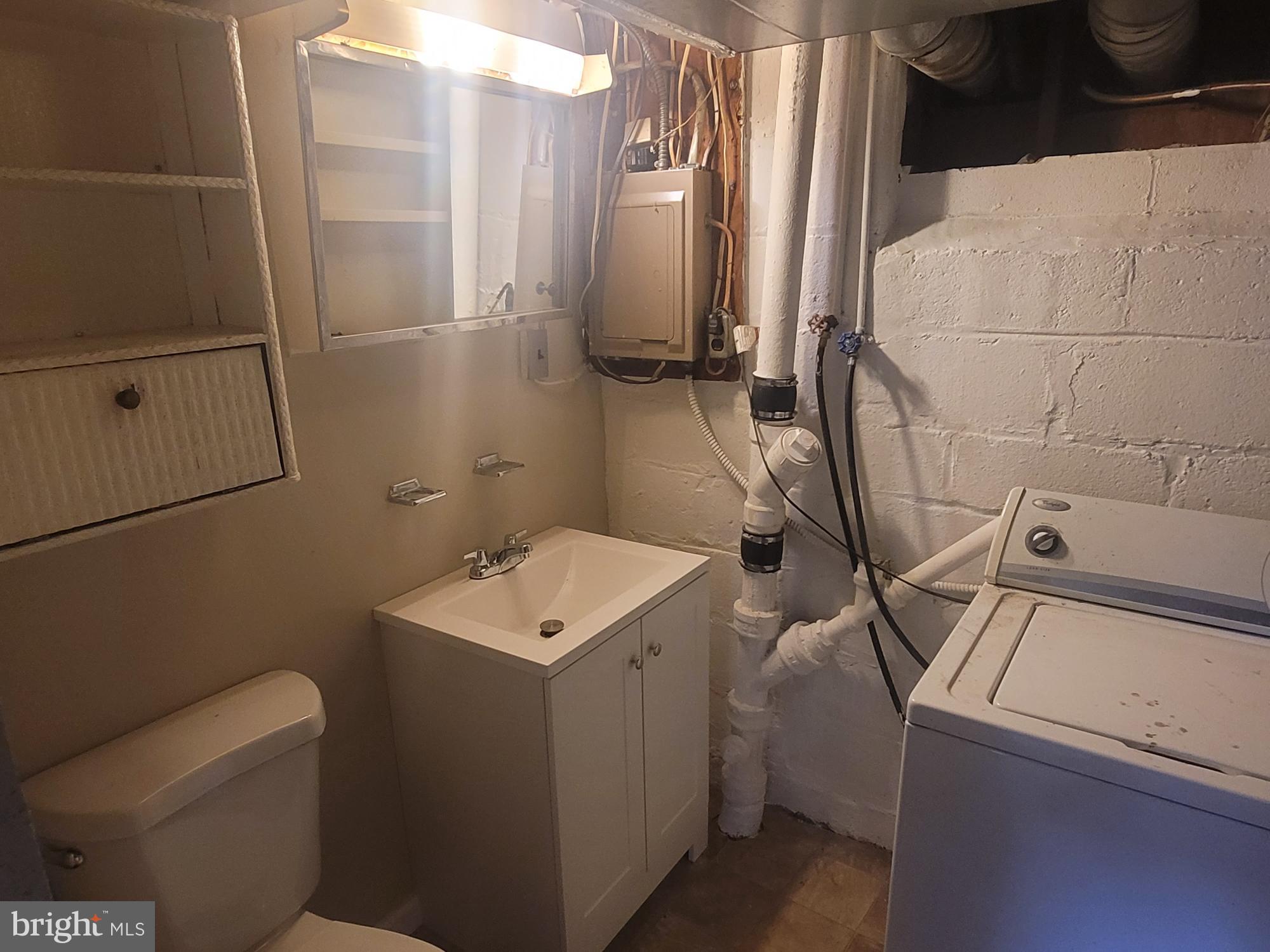 5241 Patrick Henry Drive Brooklyn, MD 21225 - Photo 25 of 33 Lower Level Laundry and Full Bath