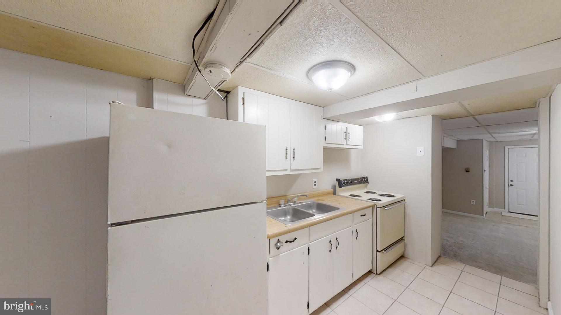 5241 Patrick Henry Drive Brooklyn, MD 21225 - Photo 27 of 33 Lower Level Kitchen