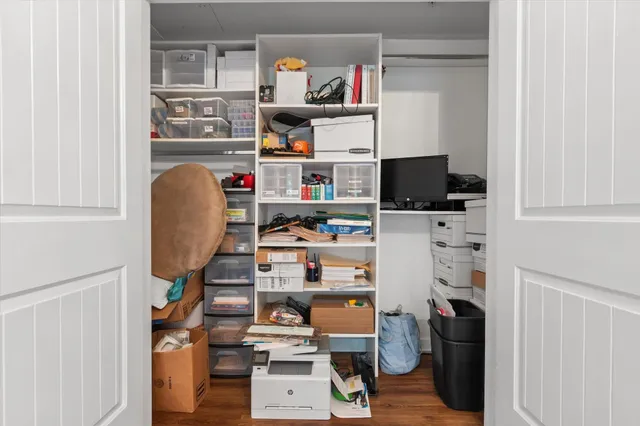 a room with workspace and a window