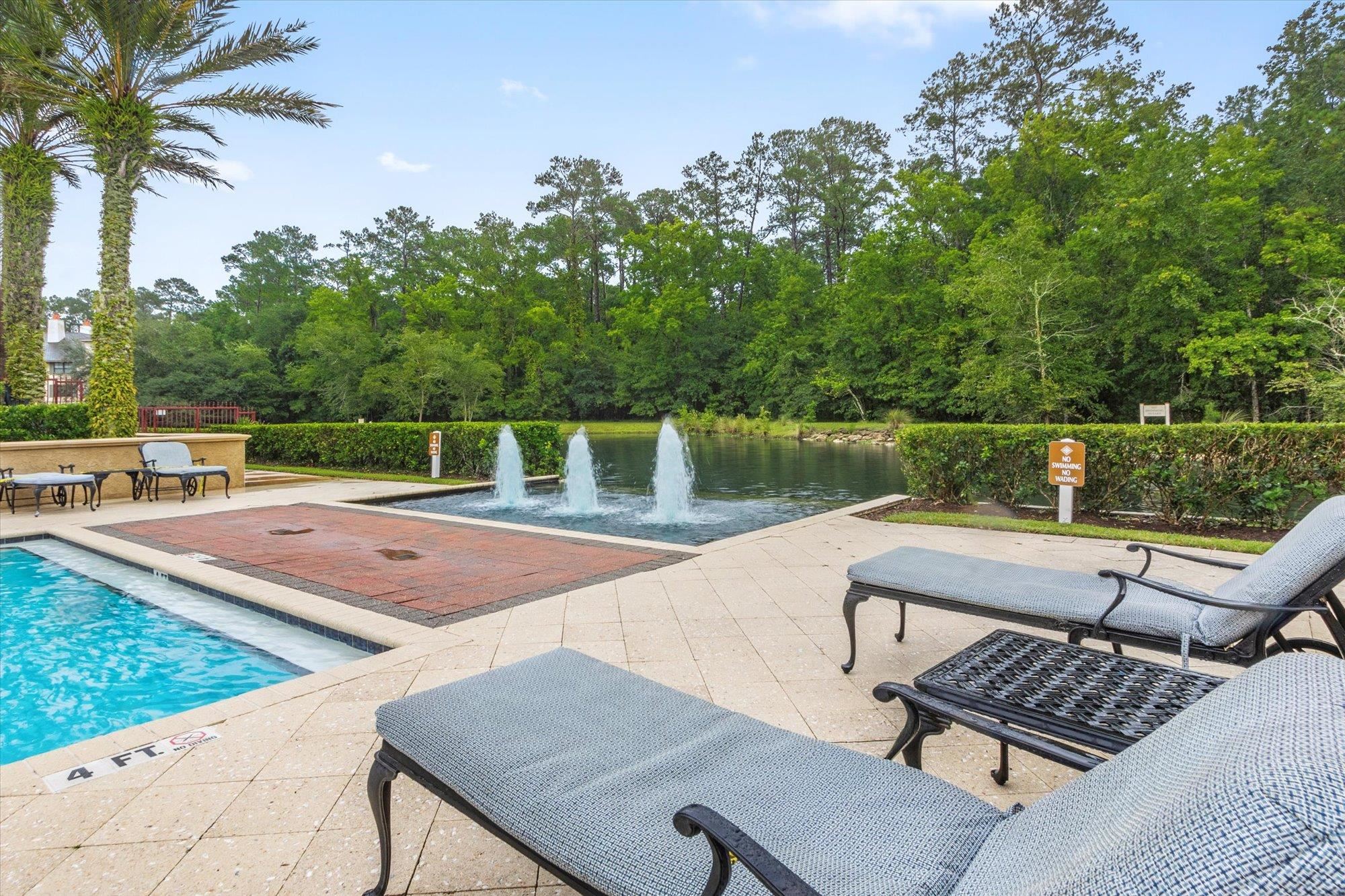 955 Registry Boulevard, Unit 105 St. Augustine, FL 32092 - Photo 29 of 30 a view of a patio with chairs and wooden floor