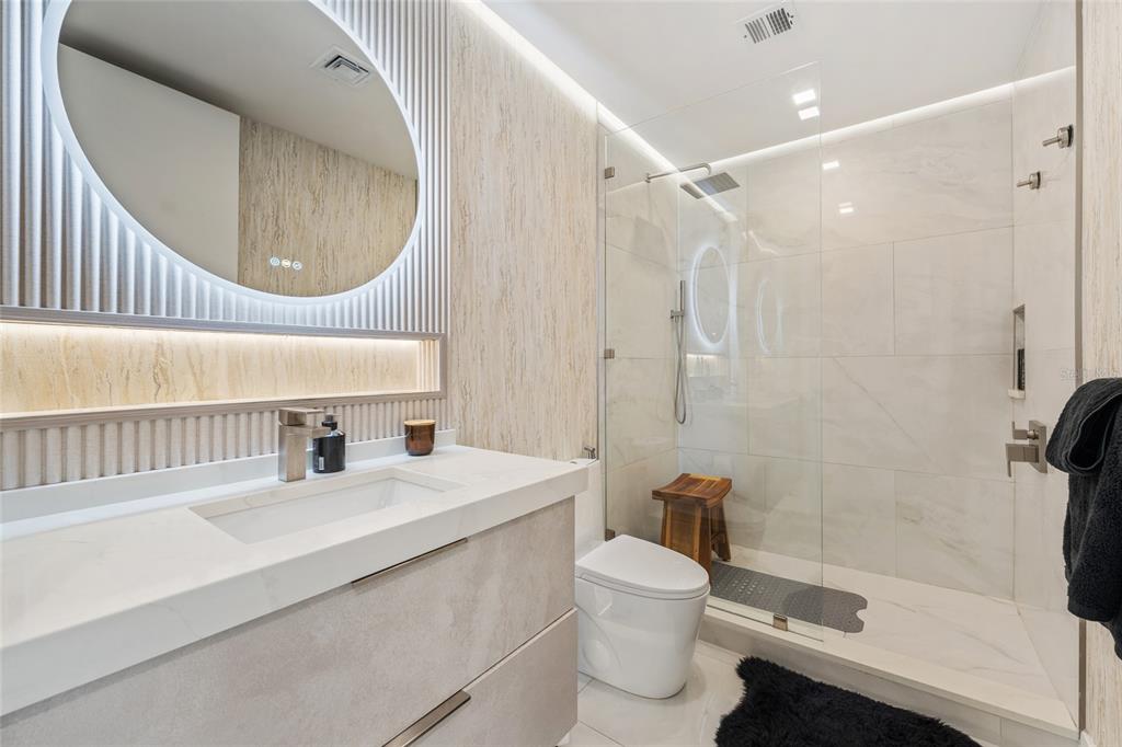 150 East Robinson Street, Unit 601 Orlando, FL 32801 - Photo 12 of 23 a bathroom with a sink a toilet and shower