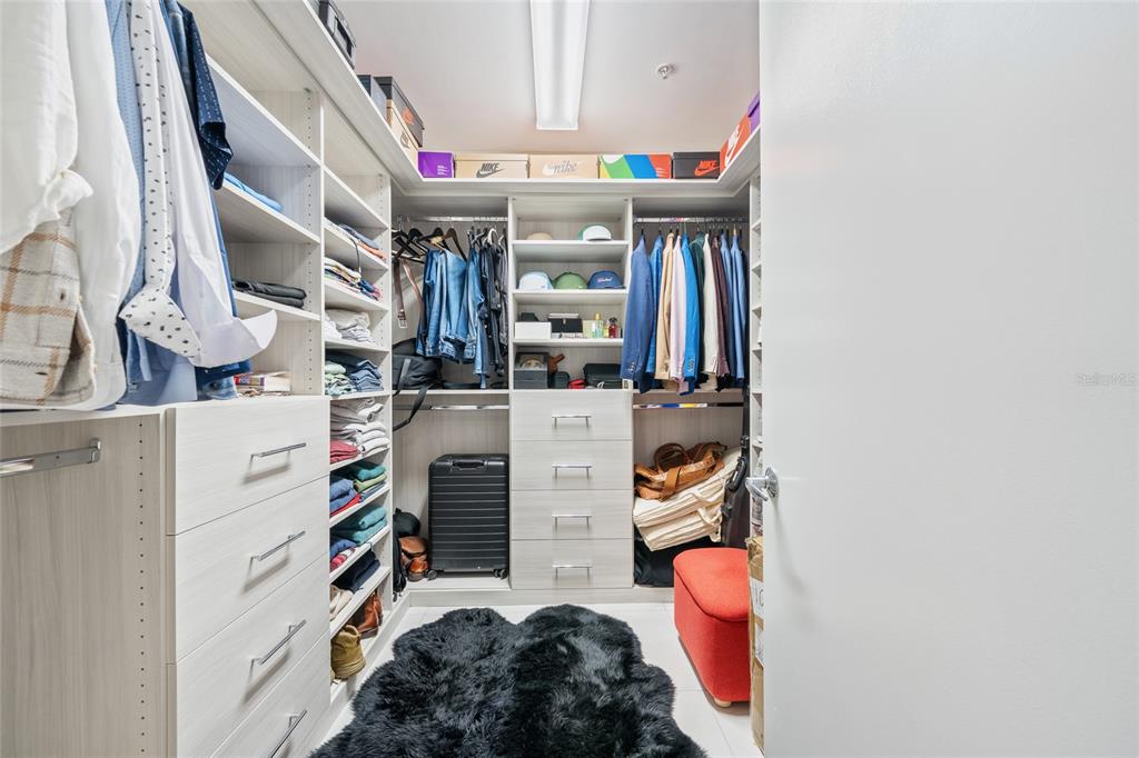 150 East Robinson Street, Unit 601 Orlando, FL 32801 - Photo 15 of 23 walk in closet with clothes and shoes