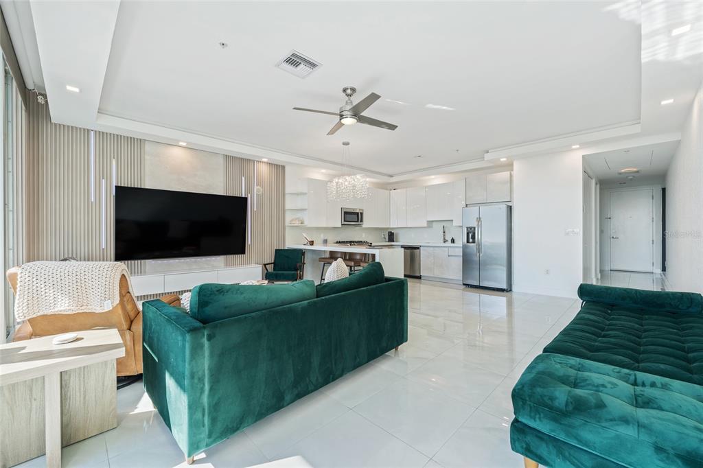 150 East Robinson Street, Unit 601 Orlando, FL 32801 - Photo 16 of 23 a living room with furniture and a flat screen tv