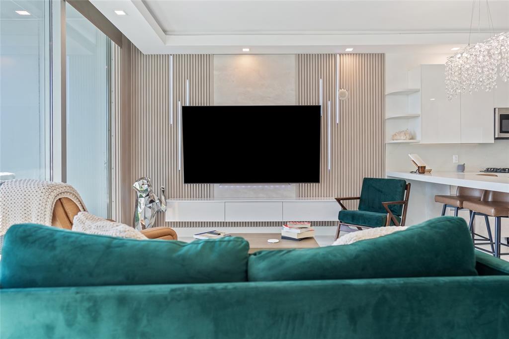 150 East Robinson Street, Unit 601 Orlando, FL 32801 - Photo 17 of 23 a living room with furniture and a flat screen tv