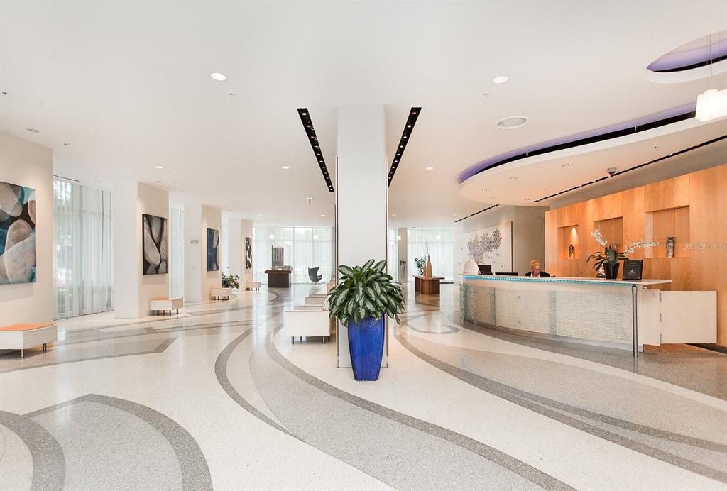 150 East Robinson Street, Unit 601 Orlando, FL 32801 - Photo 3 of 23 a dining room with furniture and a large window