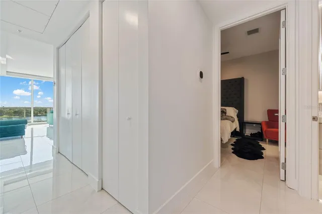 a kitchen with stainless steel appliances a stove a sink a microwave a refrigerator and cabinets