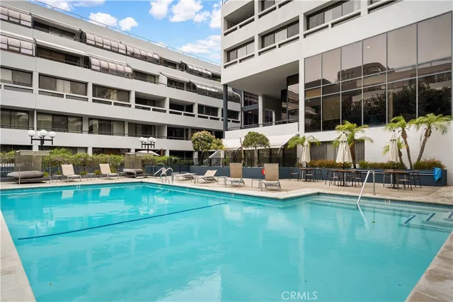 a view of swimming pool with outdoor seating