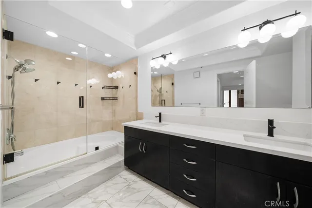 a bathroom with a bathtub and a shower