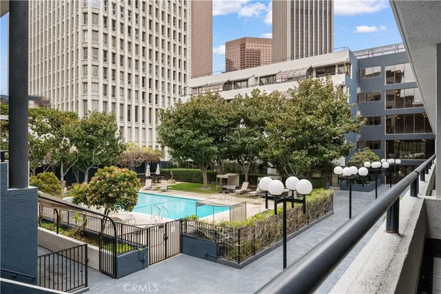 a view of a swimming pool with a lounge chairs