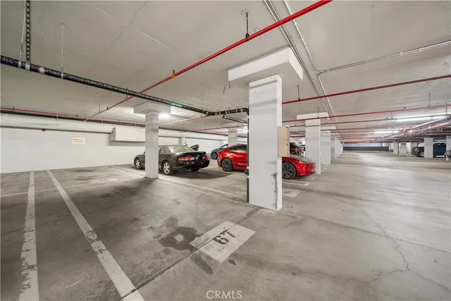 an aerial view of a residential apartment building with a yard and potted plants