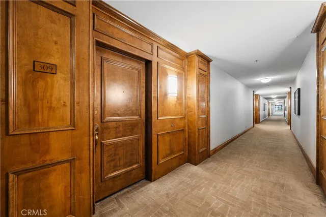 a kitchen with stainless steel appliances kitchen island granite countertop a stove and a refrigerator