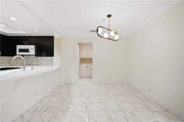 a view of an empty room and a window