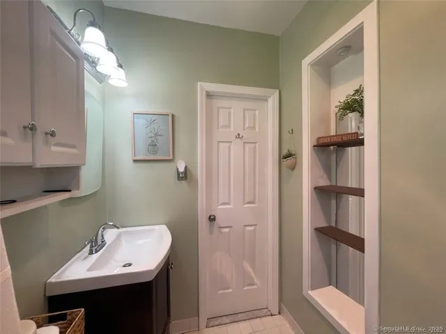 a bathroom with a sink and a mirror