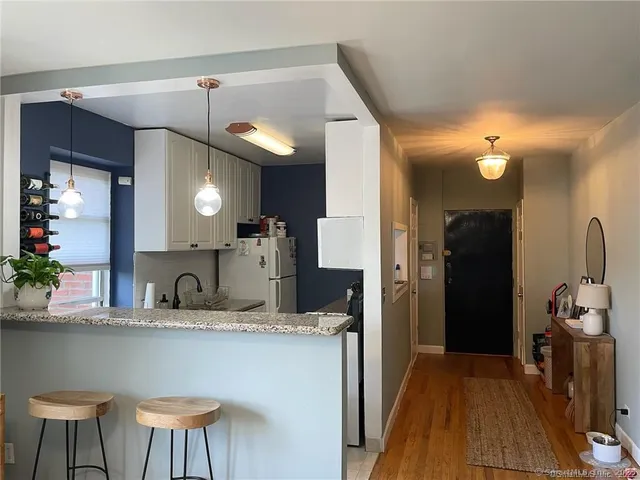 a kitchen with a table and chairs in it