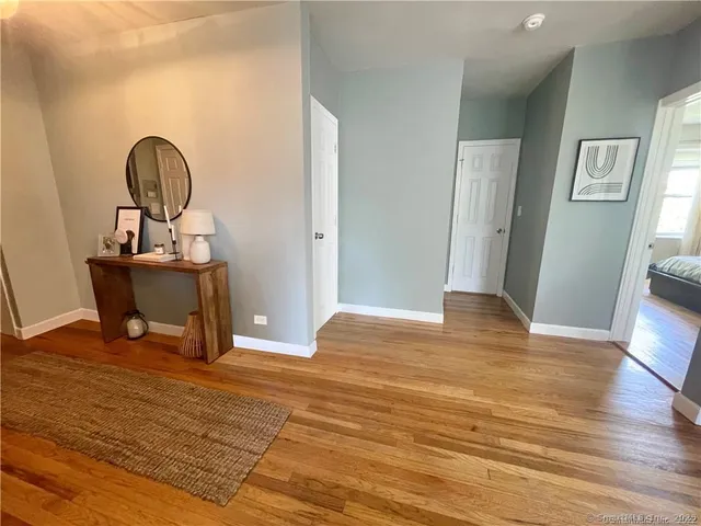 a room with furniture and wooden floor