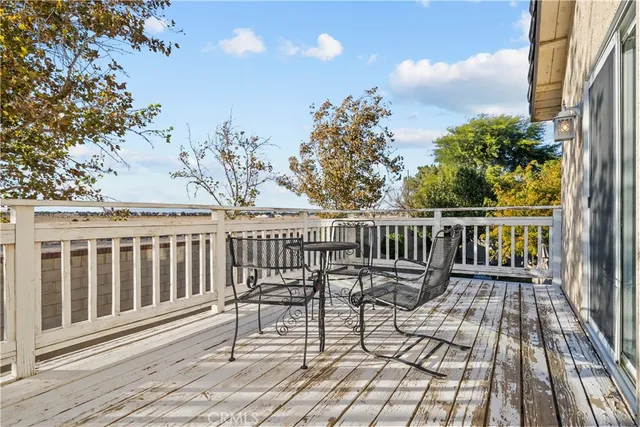 a view of a chair and table on the wooden floor