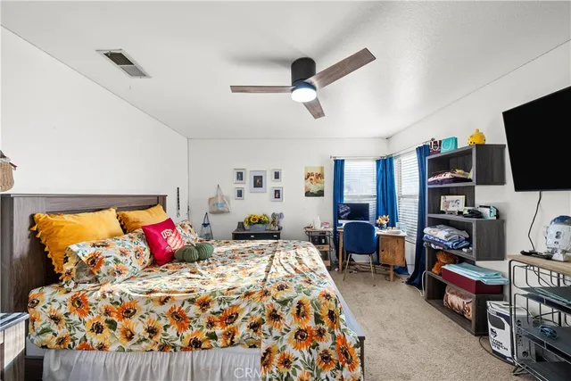 a bedroom with a bed and furniture in it