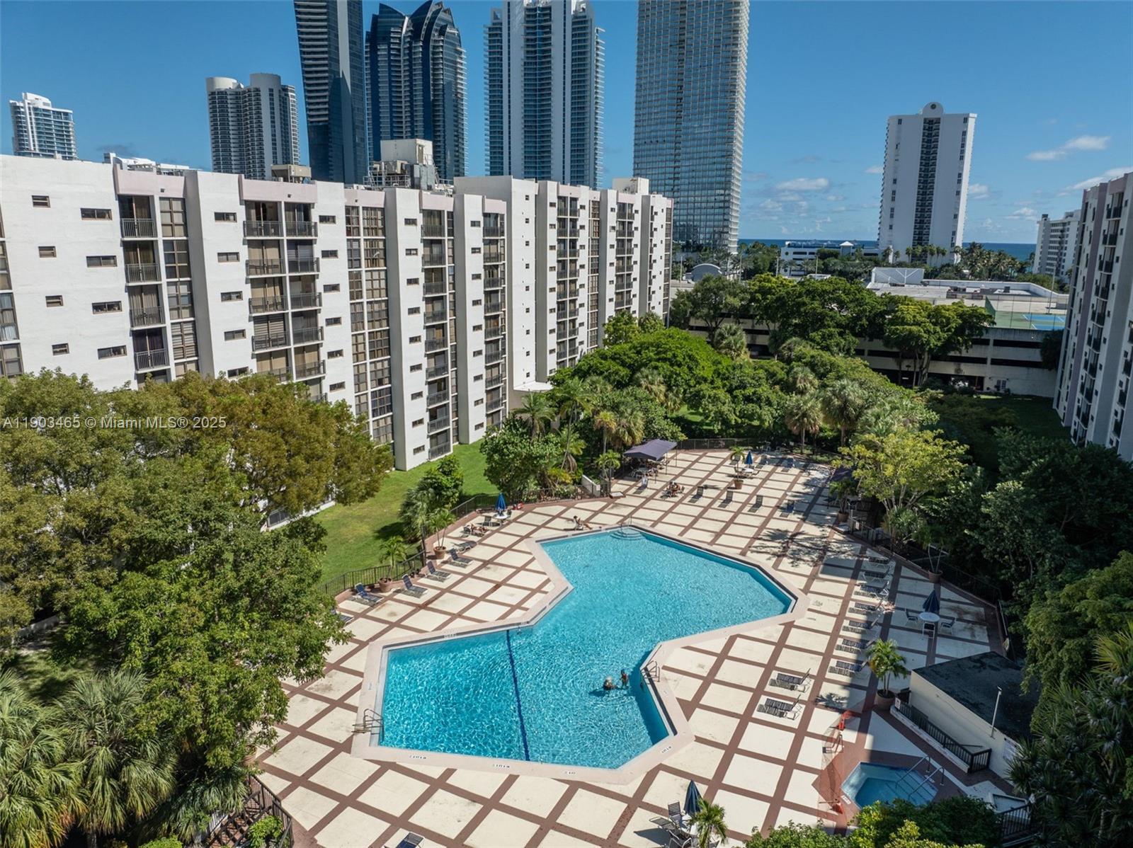17021 North Bay Road, Unit 516 Sunny Isles Beach, FL 33160 - Photo 11 of 14 a view of a patio with table and chairs and potted plants