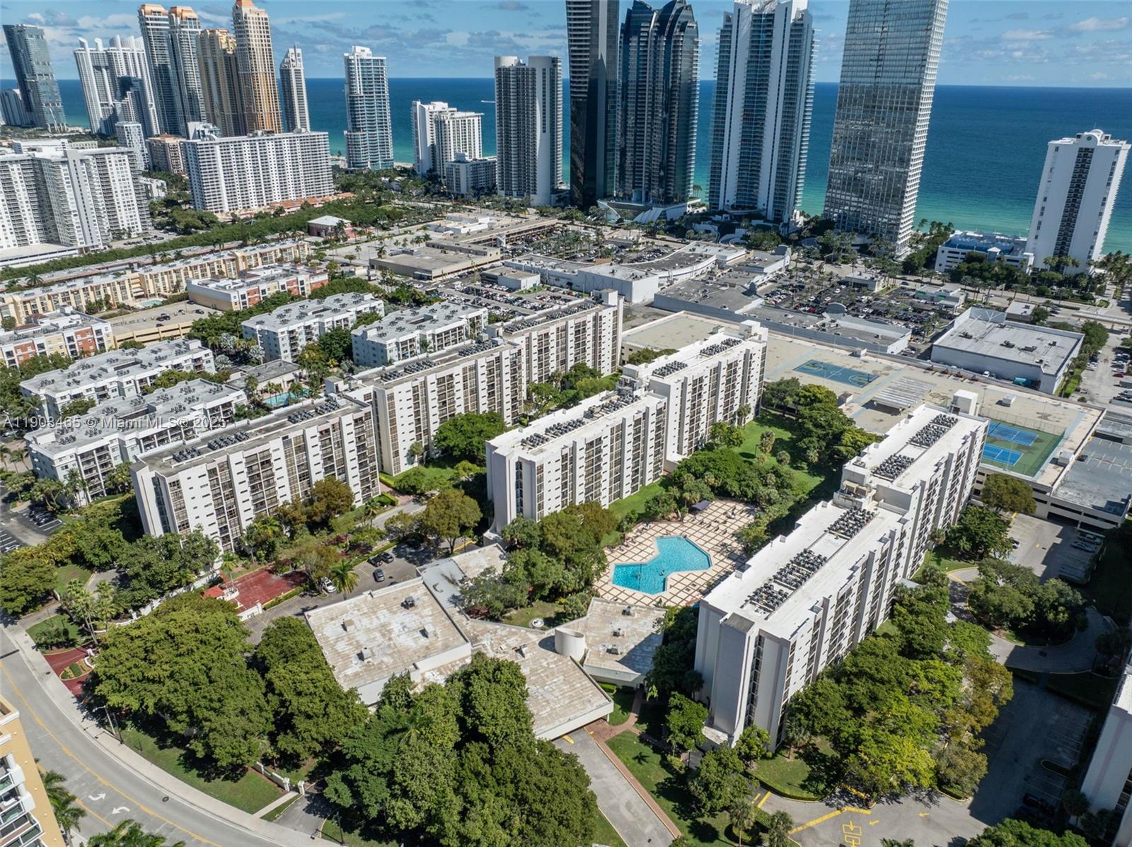 17021 North Bay Road, Unit 516 Sunny Isles Beach, FL 33160 - Photo 10 of 14 a view of a backyard with plants and outdoor seating