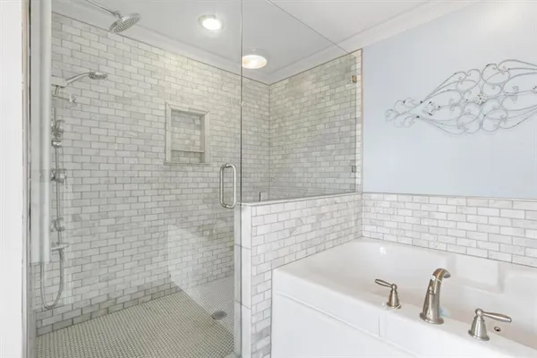a bathroom with a sink a shower and a mirror