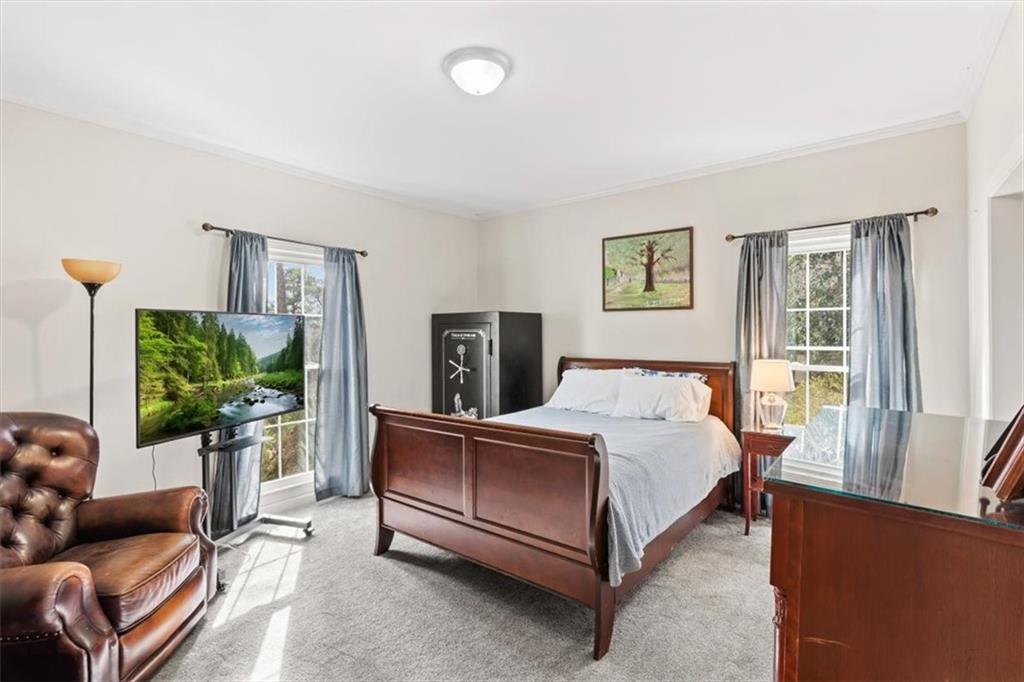 20 Pine Valley Road Rome, GA 30165 - Photo 22 of 36 a spacious bedroom with a bed and a couch