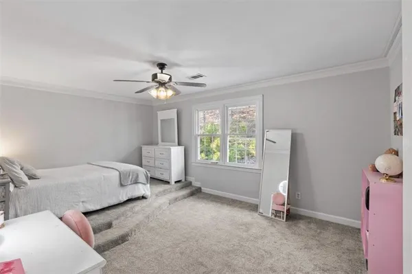 a bed room with a bed and a window