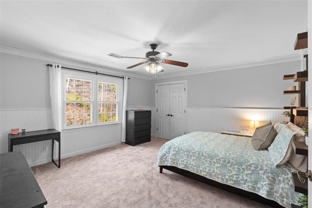 20 Pine Valley Road Rome, GA 30165 - Photo 27 of 36 a bedroom with a bed and a chandelier