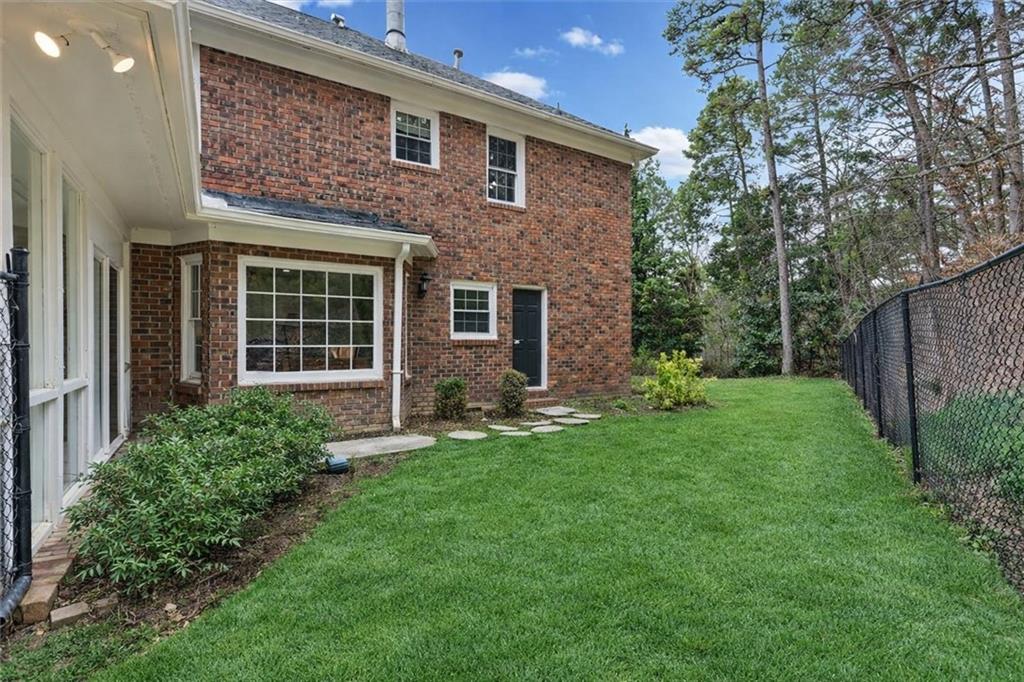 20 Pine Valley Road Rome, GA 30165 - Photo 3 of 36 a view of a brick house with a big yard and large tree