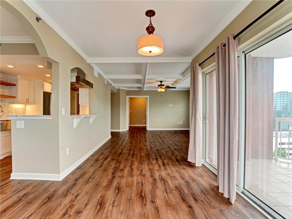 3435 Kingsboro Road Northeast, Unit 1601 Atlanta, GA 30326 - Photo 12 of 54 a view of a hallway with wooden floor